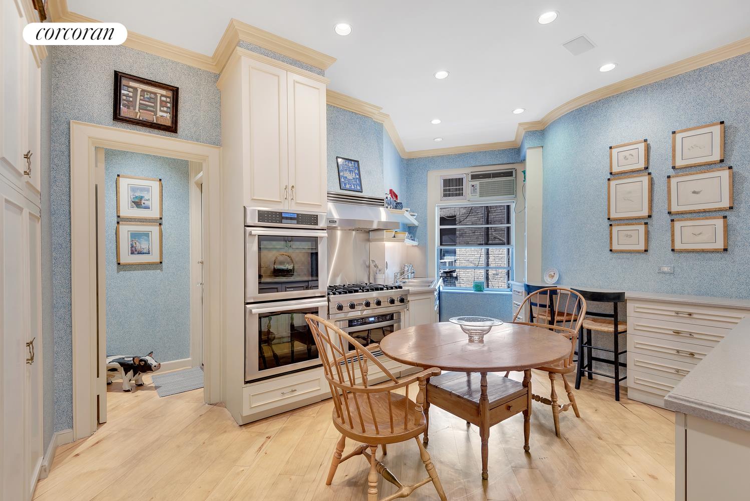 555 Park Avenue, Unit 9E Manhattan, NY 10065 - Photo 5 of 11 a view of a dining room with furniture