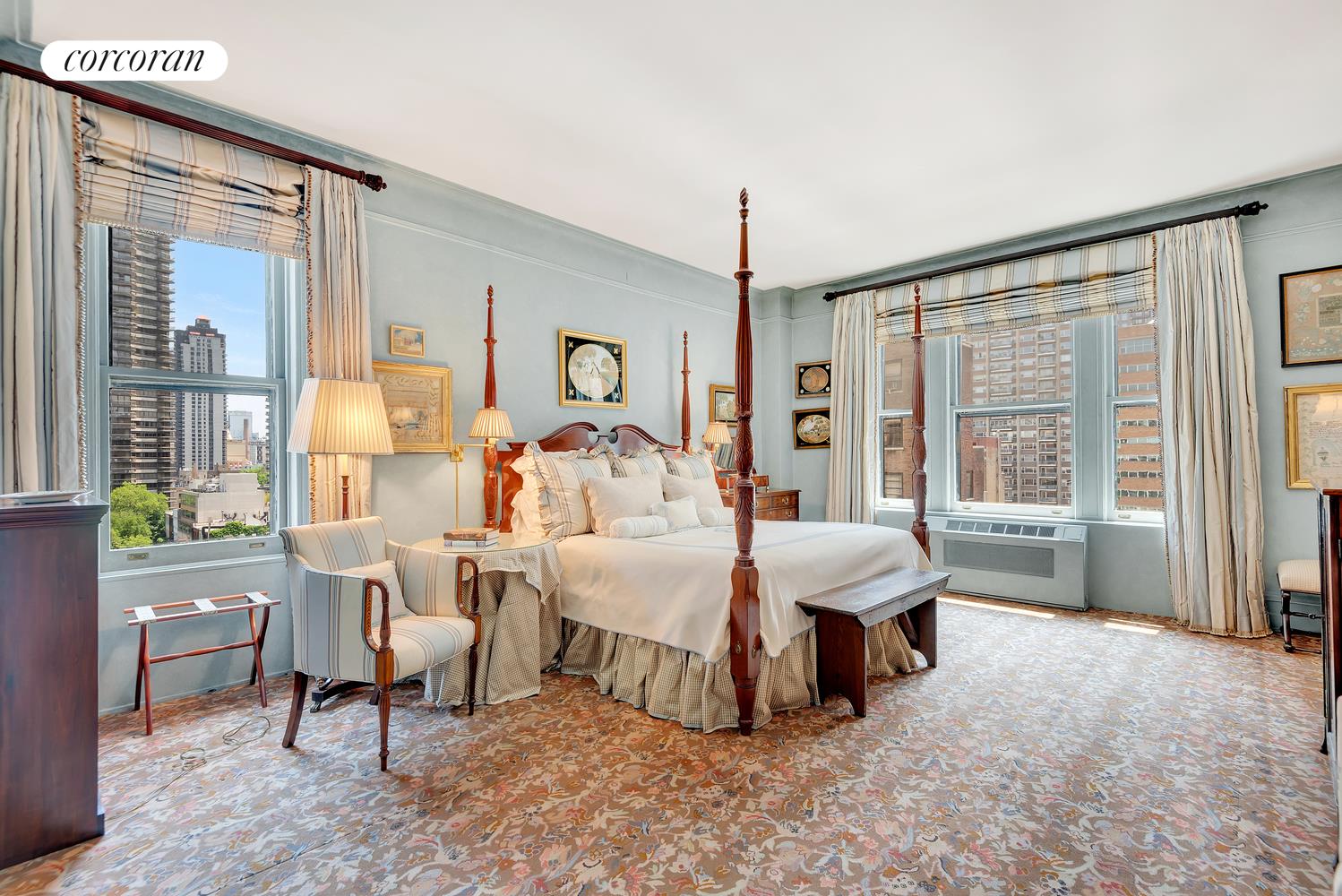 555 Park Avenue, Unit 9E Manhattan, NY 10065 - Photo 8 of 11 a bedroom with a bed and large windows