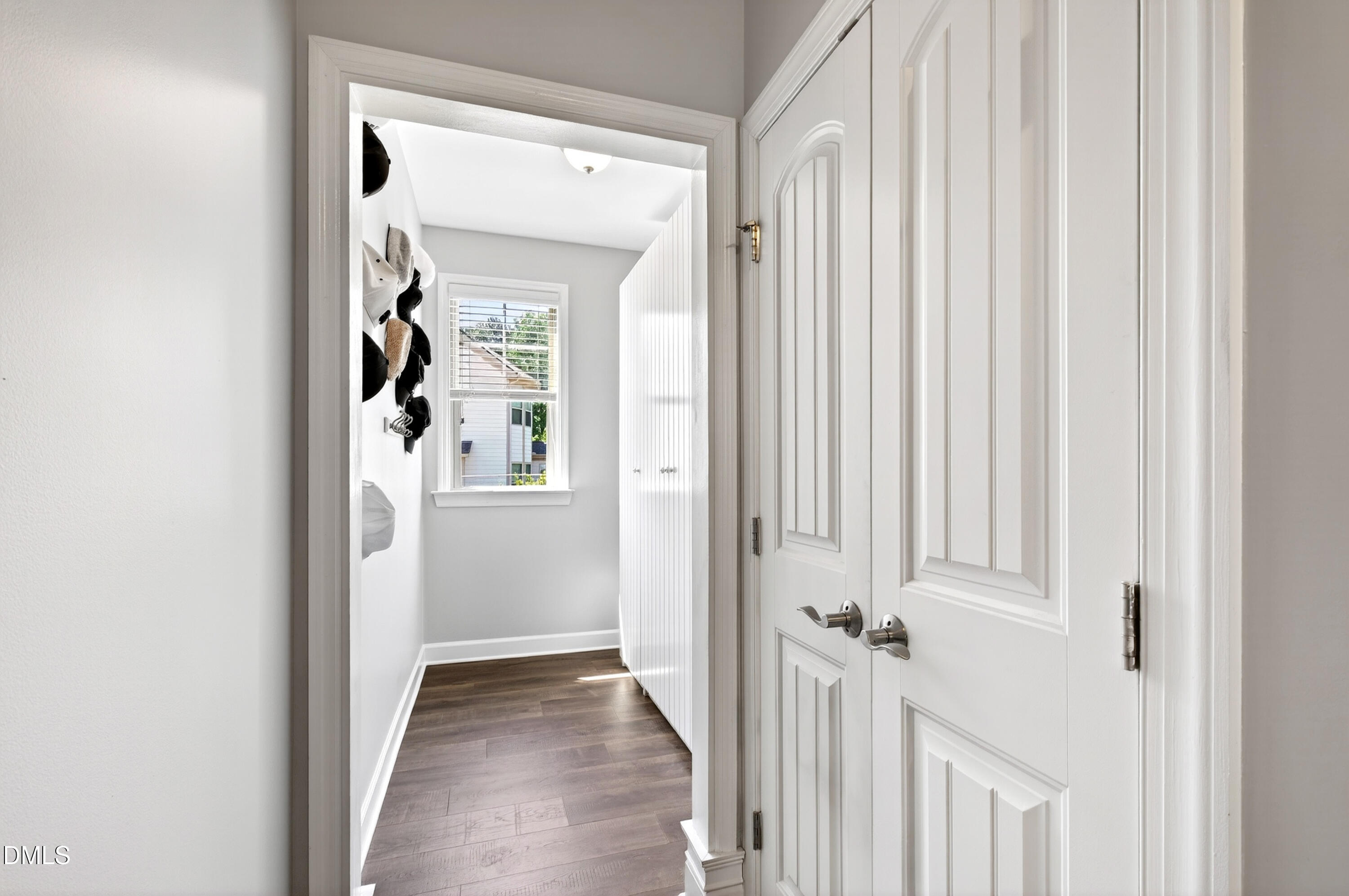 313 Karpen Lane Cary, NC 27519 - Photo 33 of 86 a view of a hallway with wooden shelves