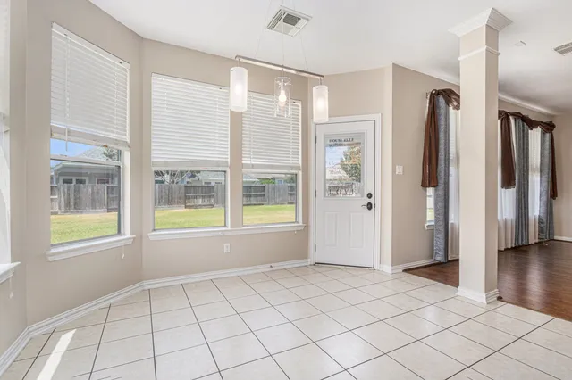 a view of an empty room and window