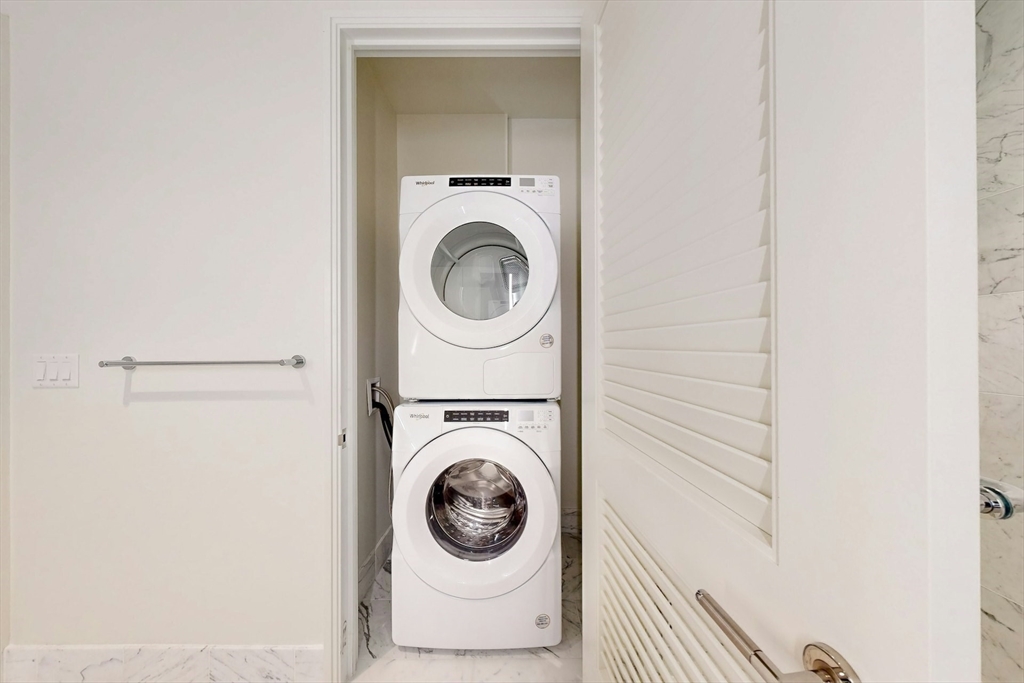 240 Devonshire Street, Unit 4011 Boston, MA 02110 - Photo 13 of 21 a utility room with dryer and washer