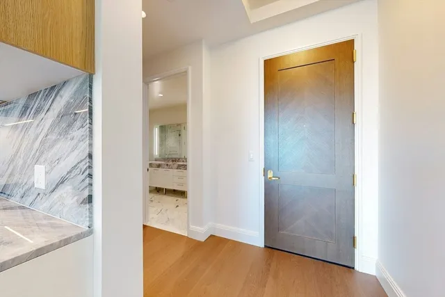 a view of a bathroom from a hallway