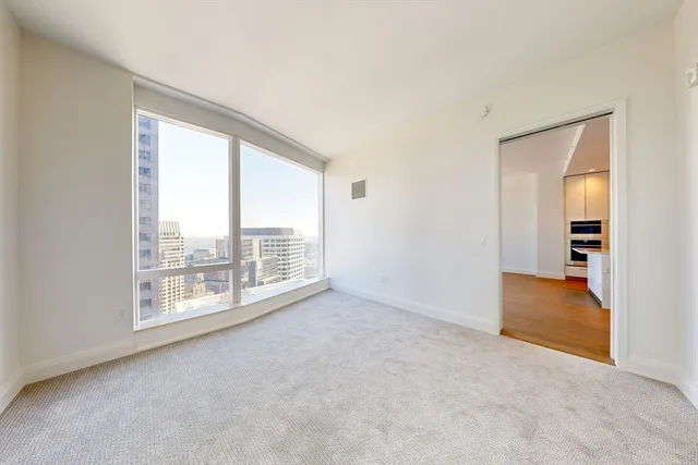 a view of an empty room with a window