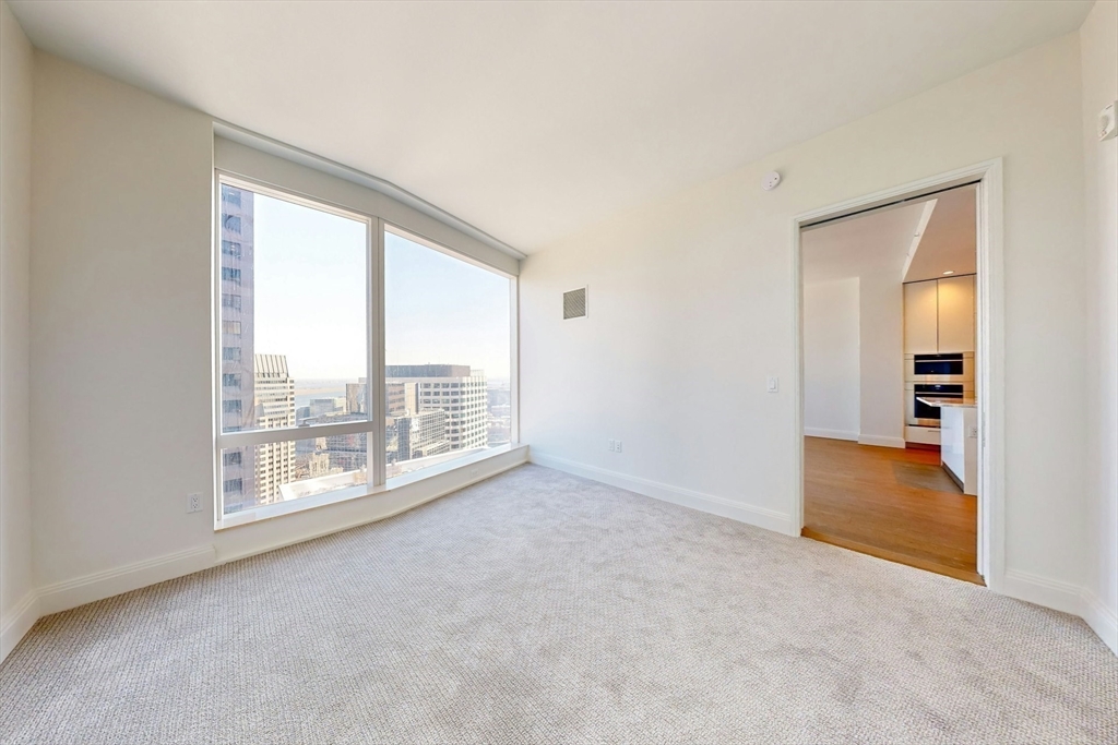 240 Devonshire Street, Unit 4011 Boston, MA 02110 - Photo 10 of 21 a view of an empty room with a window