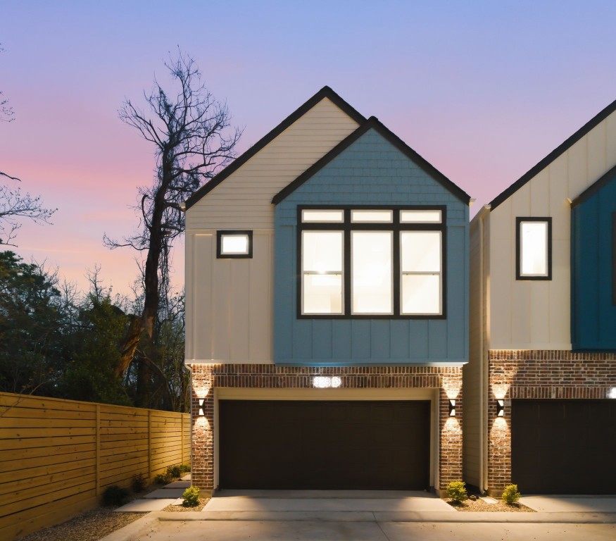 a front view of a house with yard