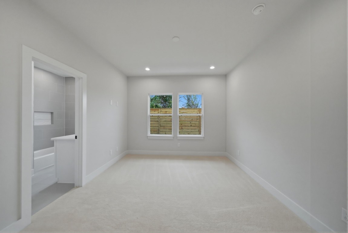 328 Janisch Road, Unit D Houston, TX 77018 - Photo 11 of 37 a view of an empty room with a window