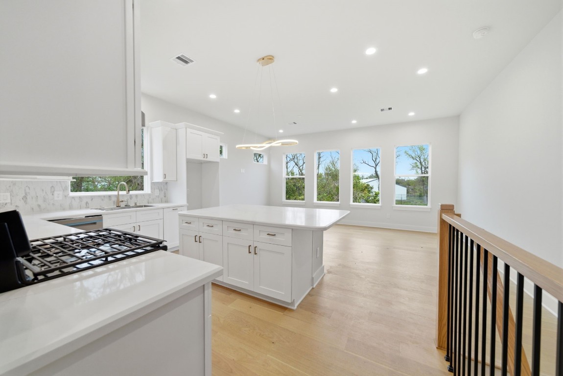 328 Janisch Road, Unit D Houston, TX 77018 - Photo 19 of 37 a kitchen with stove and cabinets
