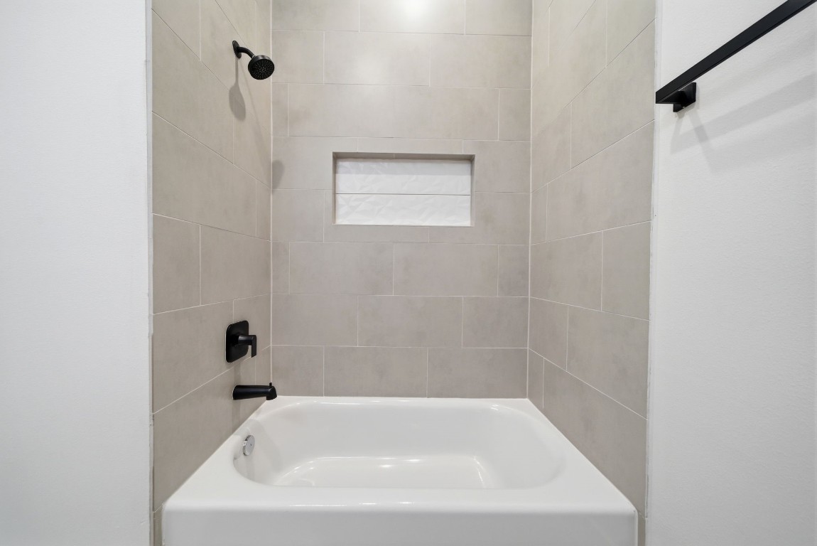 328 Janisch Road, Unit D Houston, TX 77018 - Photo 22 of 37 a white bath tub sitting in a bathroom
