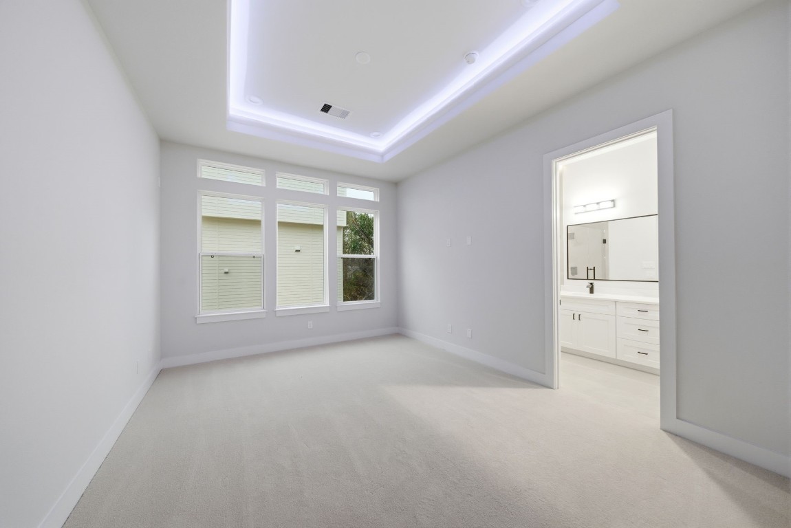 328 Janisch Road, Unit D Houston, TX 77018 - Photo 25 of 37 an empty room with windows and a sink