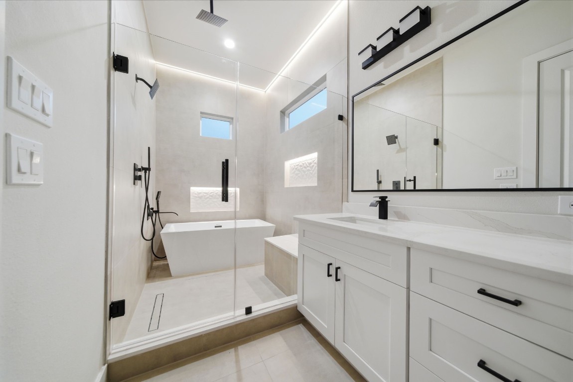 328 Janisch Road, Unit D Houston, TX 77018 - Photo 28 of 37 a bathroom with a double vanity sink mirror and shower