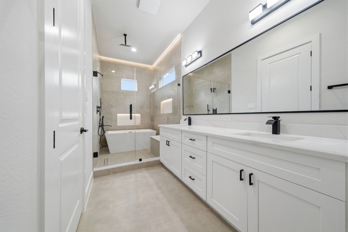 328 Janisch Road, Unit D Houston, TX 77018 - Photo 29 of 37 a spacious bathroom with a double vanity sink mirror and