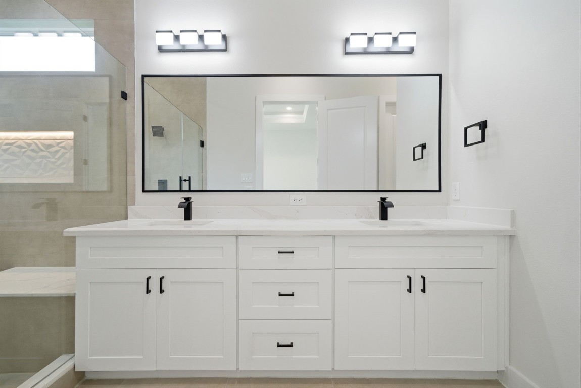 328 Janisch Road, Unit D Houston, TX 77018 - Photo 30 of 37 a bathroom with a sink mirror and vanity