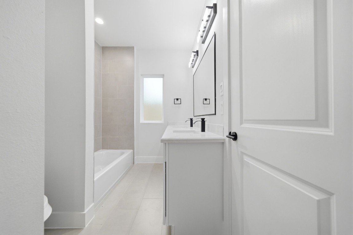 328 Janisch Road, Unit D Houston, TX 77018 - Photo 8 of 37 a bathroom with a sink a toilet and shower