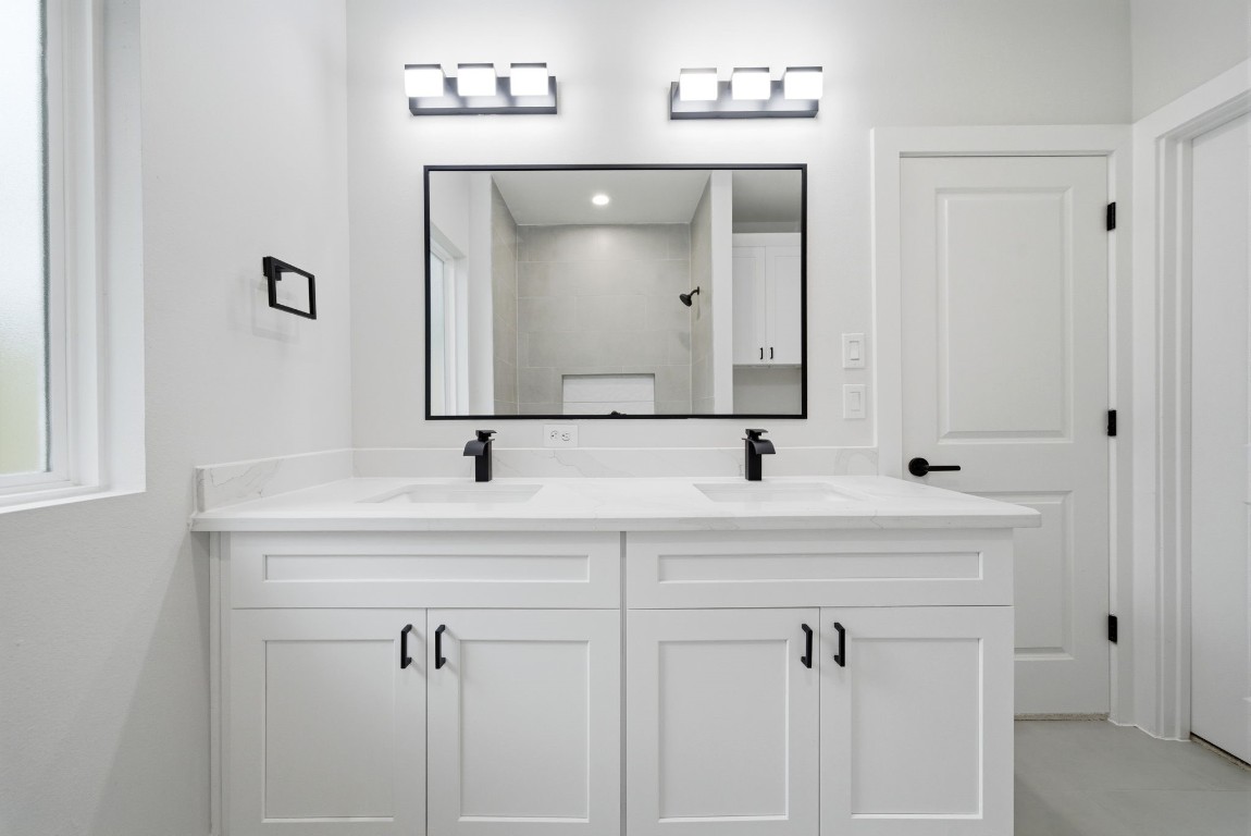 328 Janisch Road, Unit D Houston, TX 77018 - Photo 9 of 37 a bathroom with a sink vanity and mirror