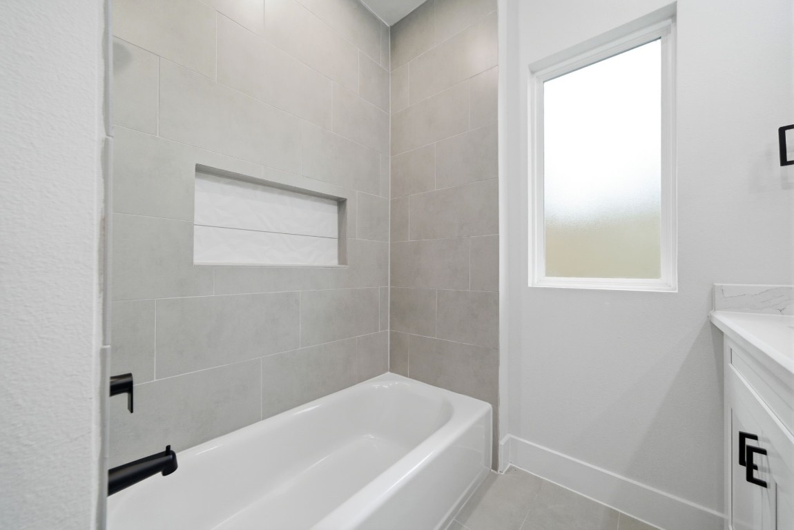 328 Janisch Road, Unit D Houston, TX 77018 - Photo 10 of 37 a white bath tub sitting next to a white sink