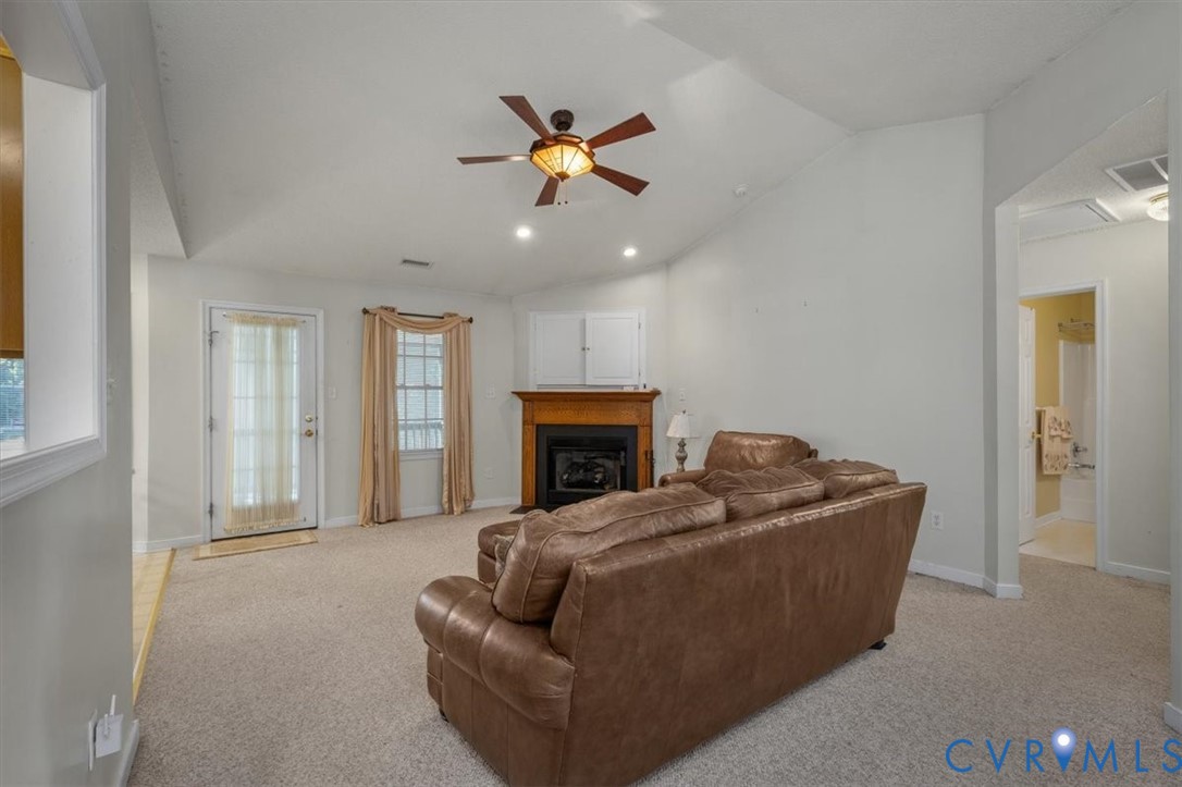 4319 Stately Oak Road North Chesterfield, VA 23234 - Photo 10 of 51 Vaulted ceiling with a ceiling fan, fireplace with