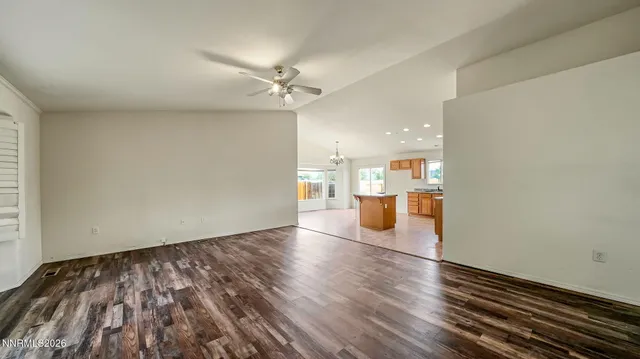 a view of a kitchen with wooden floor and a kitchen
