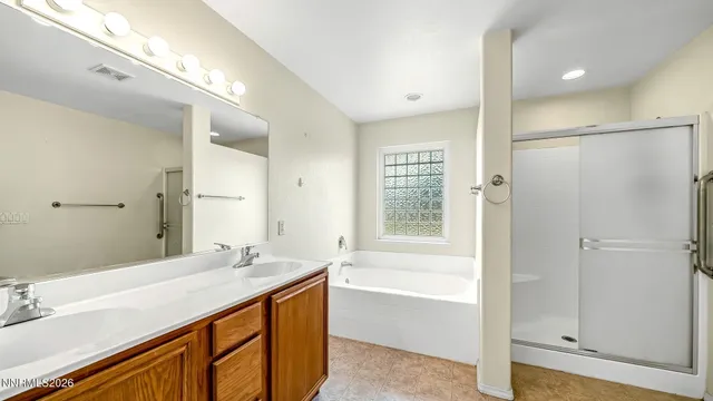 a bathroom with a bathtub and a sink