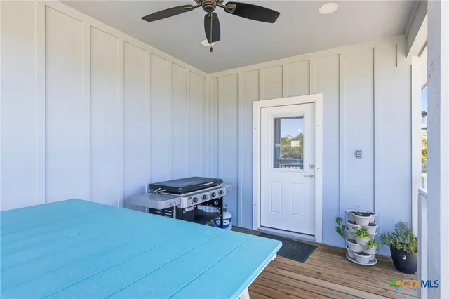 a workspace with furniture and a floor to ceiling window