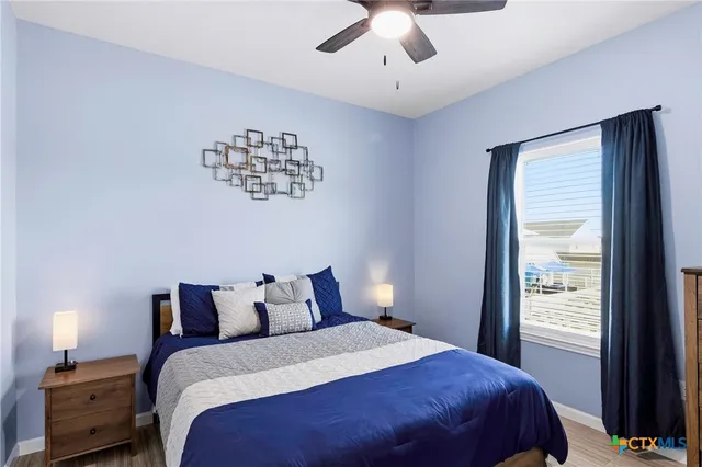 a view of a balcony with wooden floor chairs