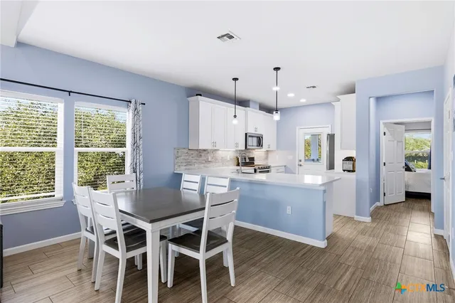 a bedroom with a bed and lamp