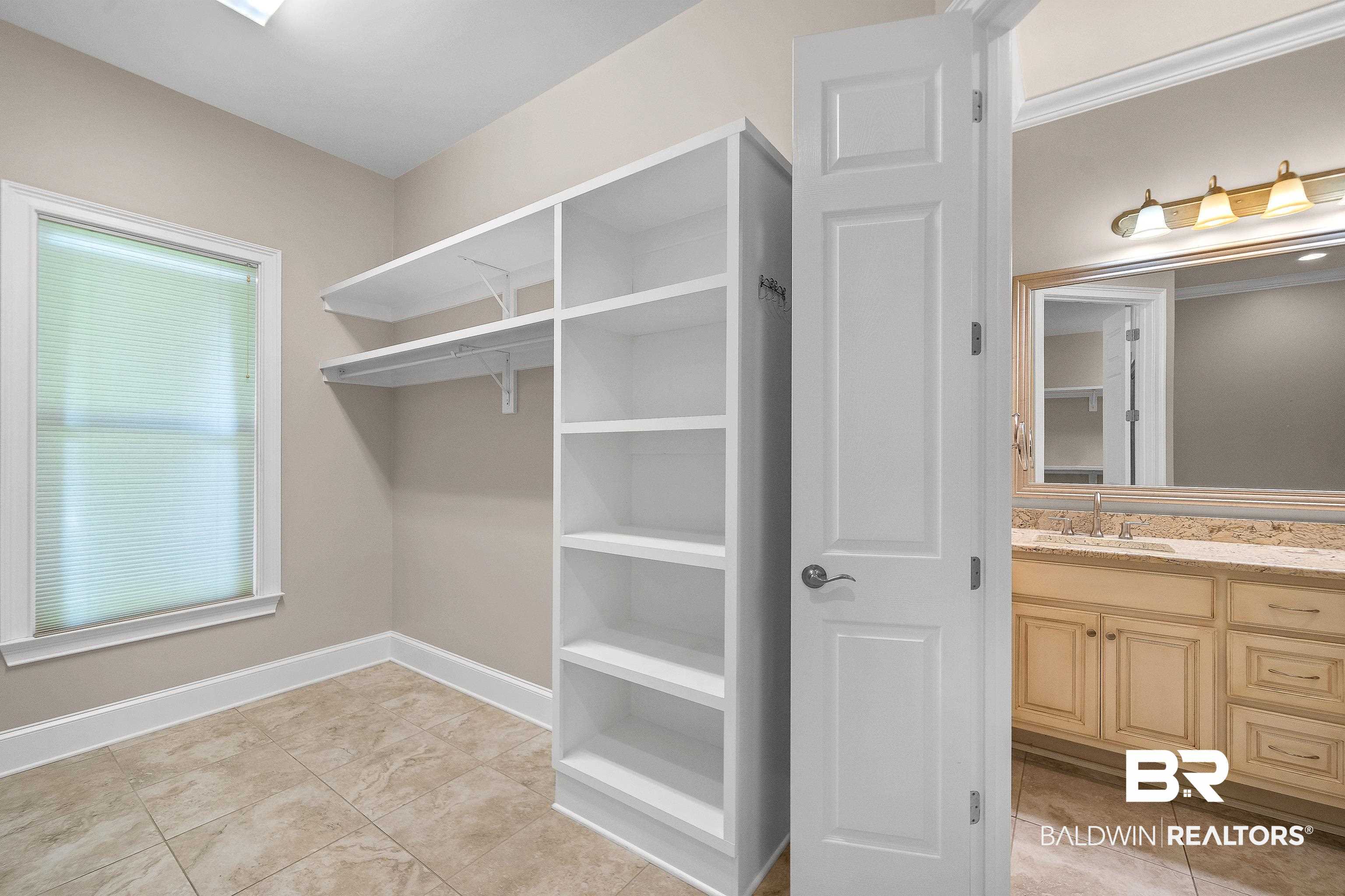17663 Burwick Loop Fairhope, AL 36532 - Photo 31 of 41 Interior space featuring light tile patterned floors and sink