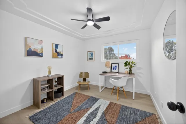 a bedroom with a bed and a chair