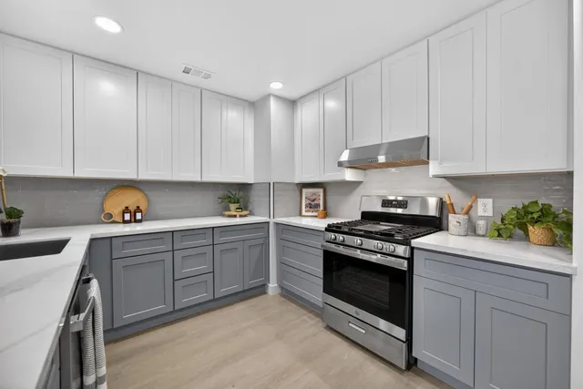 a view of a house with a yard and garage