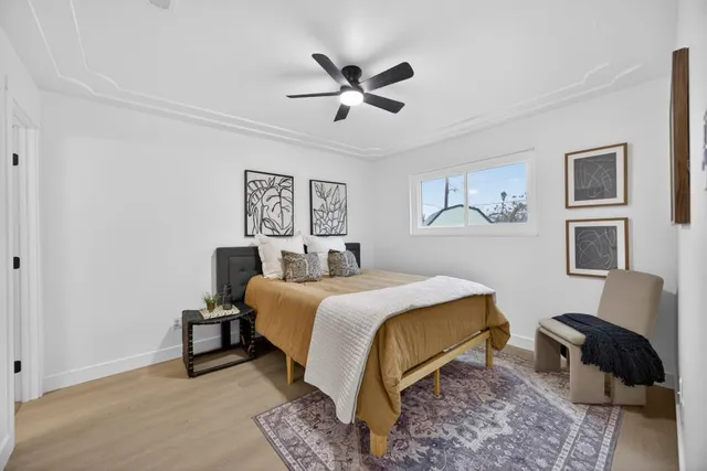 a bedroom with furniture and a window