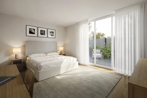 a bedroom with a large bed and a night stand