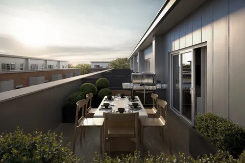 a view of a balcony with chairs and potted plants