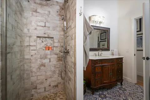 a bathroom with a sink a vanity and a mirror