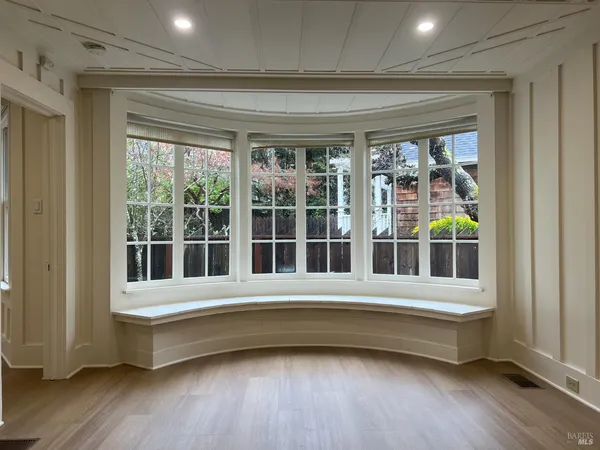a bathroom with a bathtub and a window