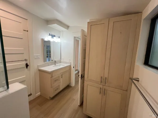 a bathroom with a double vanity sink and mirror