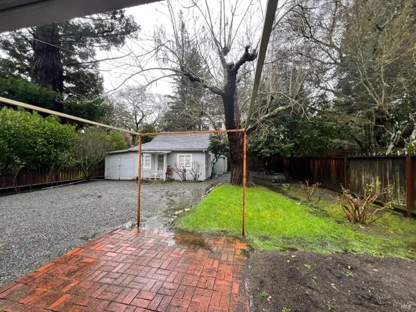 a view of a house with backyard and a slide