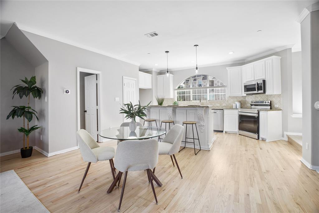 2700 Club Ridge Drive, Unit 2 Lewisville, TX 75067 - Photo 11 of 25 a view of a dining room kitchen furniture and wooden floor