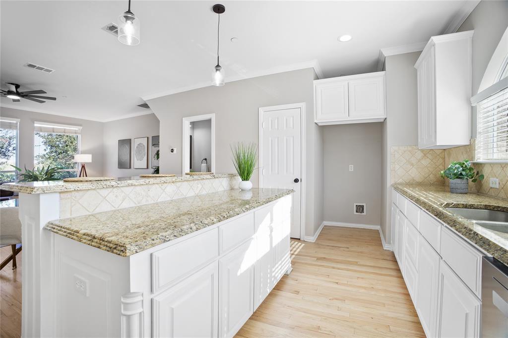 2700 Club Ridge Drive, Unit 2 Lewisville, TX 75067 - Photo 14 of 25 a large kitchen with kitchen island granite countertop a large counter top and sink