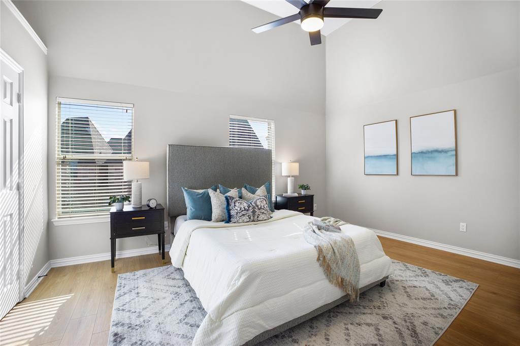 2700 Club Ridge Drive, Unit 2 Lewisville, TX 75067 - Photo 15 of 25 a bedroom with a bed and wooden floor