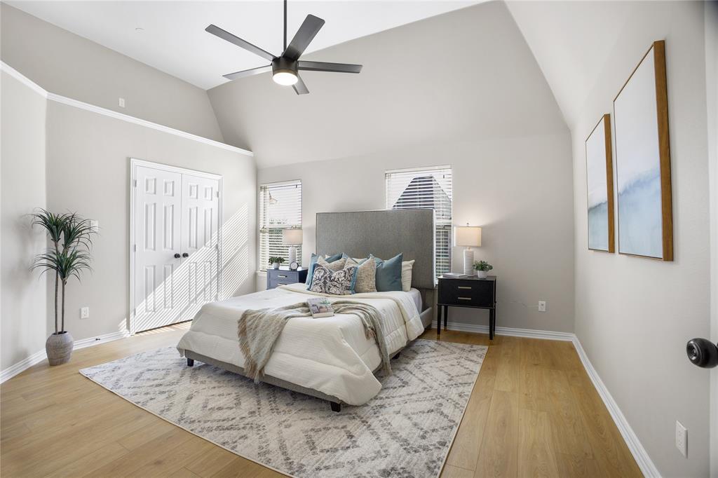 2700 Club Ridge Drive, Unit 2 Lewisville, TX 75067 - Photo 18 of 25 a spacious bedroom with a bed and a large window