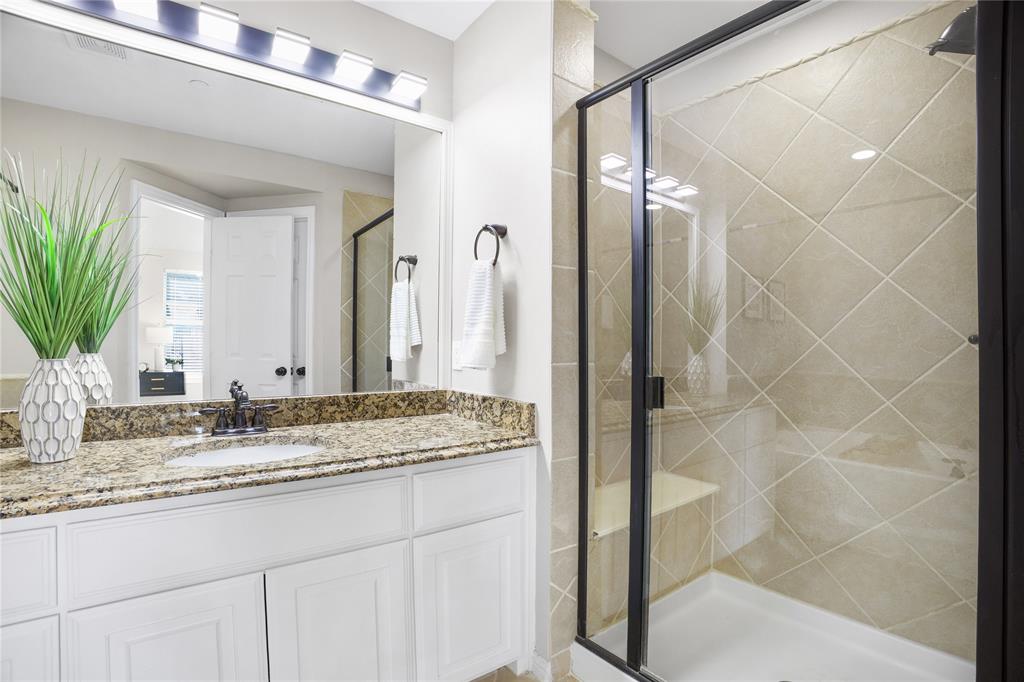 2700 Club Ridge Drive, Unit 2 Lewisville, TX 75067 - Photo 20 of 25 a bathroom with a granite countertop sink and a mirror
