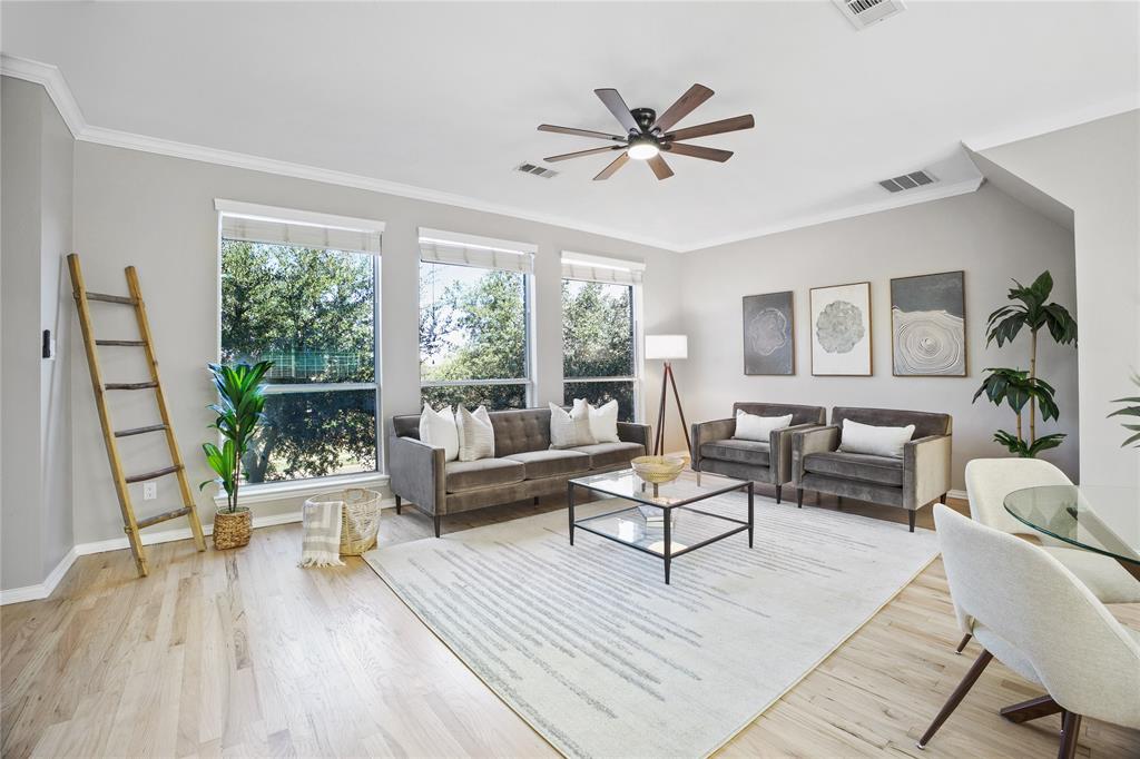 2700 Club Ridge Drive, Unit 2 Lewisville, TX 75067 - Photo 2 of 25 a living room with furniture and a large window