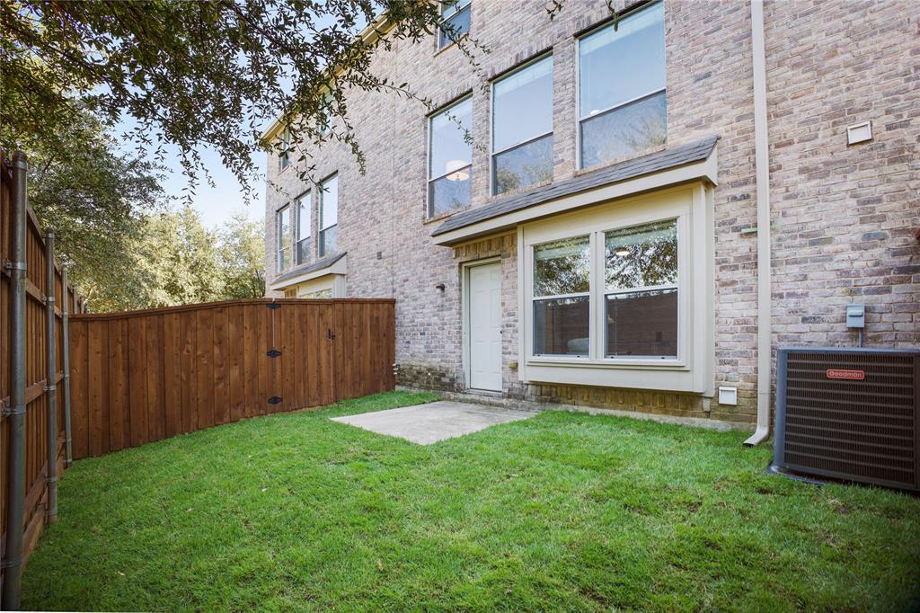 2700 Club Ridge Drive, Unit 2 Lewisville, TX 75067 - Photo 24 of 25 a view of a backyard with a garden and plants