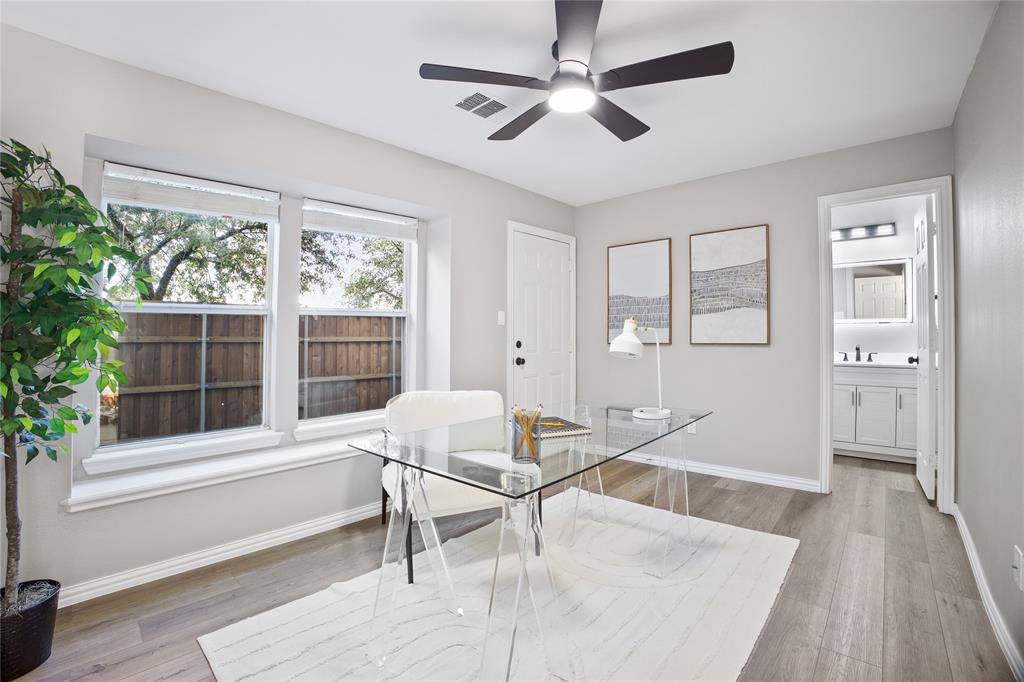 2700 Club Ridge Drive, Unit 2 Lewisville, TX 75067 - Photo 4 of 25 a workspace with wooden floor and windows