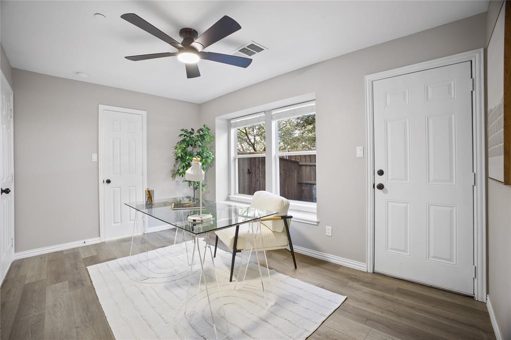 2700 Club Ridge Drive, Unit 2 Lewisville, TX 75067 - Photo 5 of 25 a living room with furniture and a large window