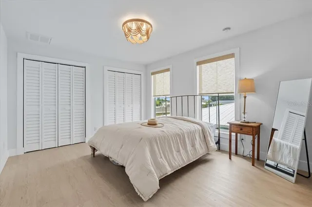 a bedroom with a bed and a table in it