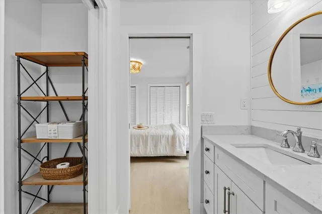 a en suite bathroom with a sink and mirror