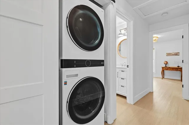 a view of a hallway with washer and dryer