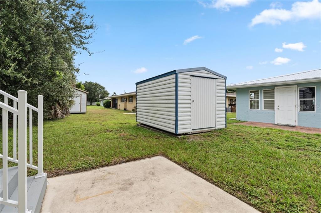 1306 McGregor Street Punta Gorda, FL 33950 - Photo 26 of 29 a backyard of a house with plants and entertaining space