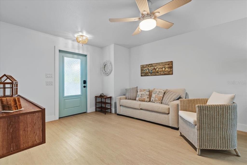 1306 McGregor Street Punta Gorda, FL 33950 - Photo 8 of 29 a living room with furniture and a chandelier