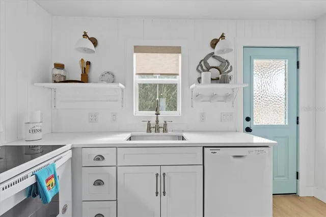 a bathroom with a sink and a window